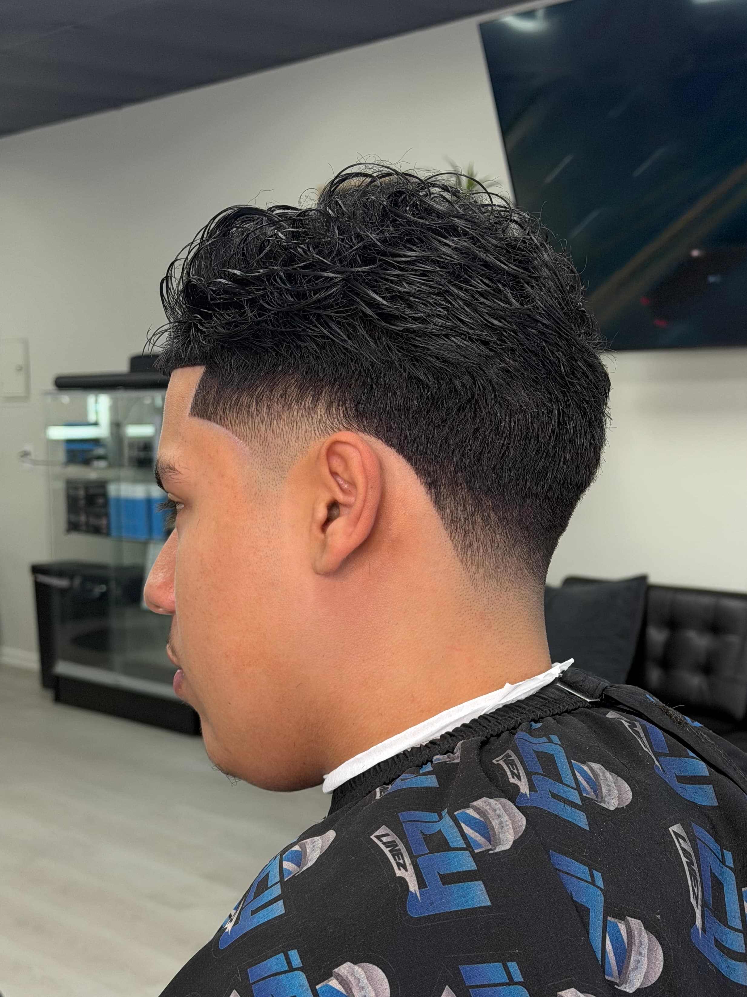 Close-up of a high skin fade with sharp line-up at The Barber Lounge